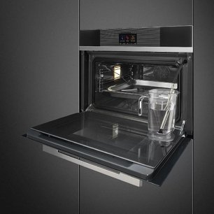Компактный духовой шкаф с пароваркой Smeg SF4104WVCPN фото 2 в Челябинске
